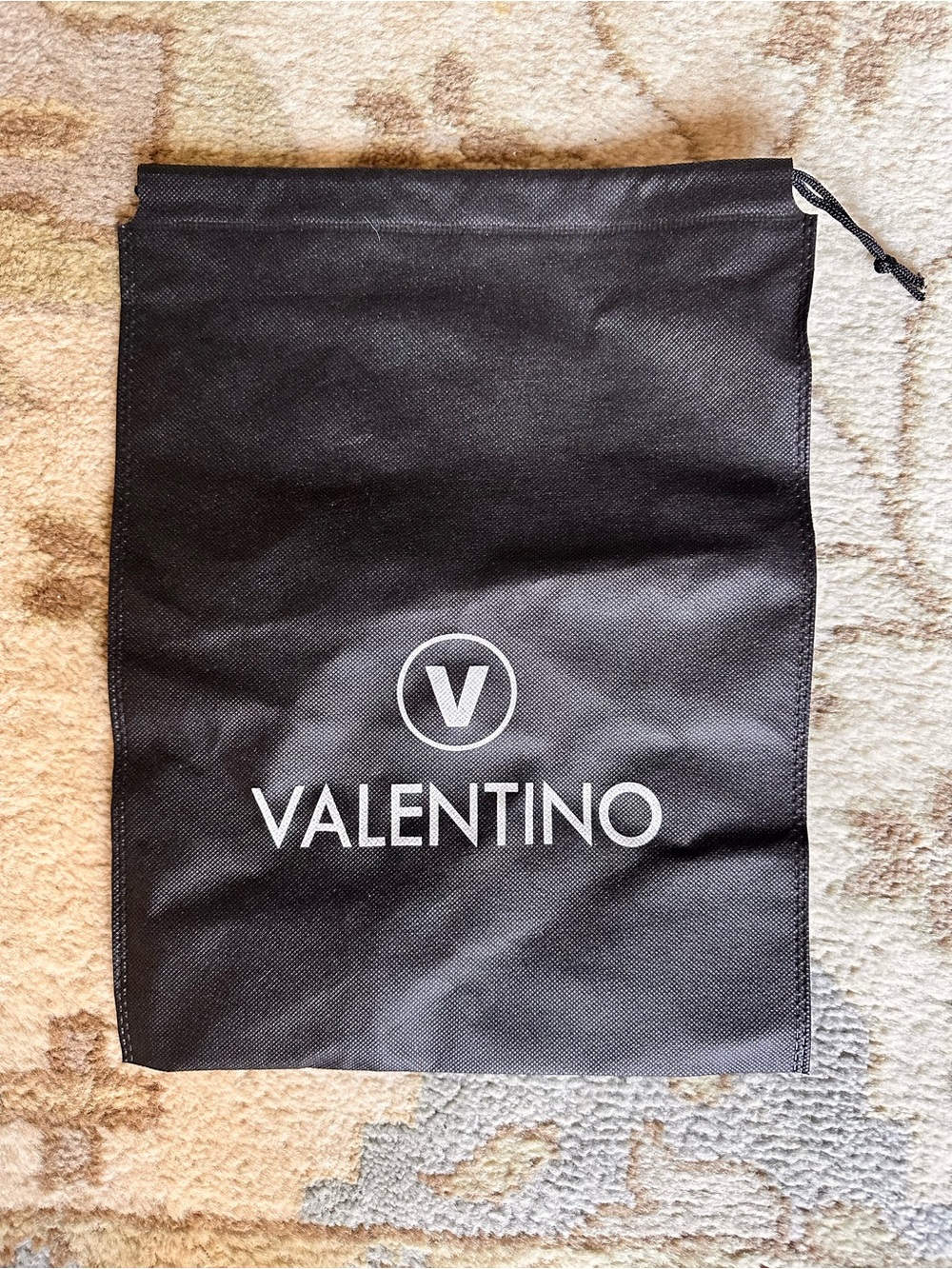 Black Valentino branded drawstring dust/storage bag with white logo on front